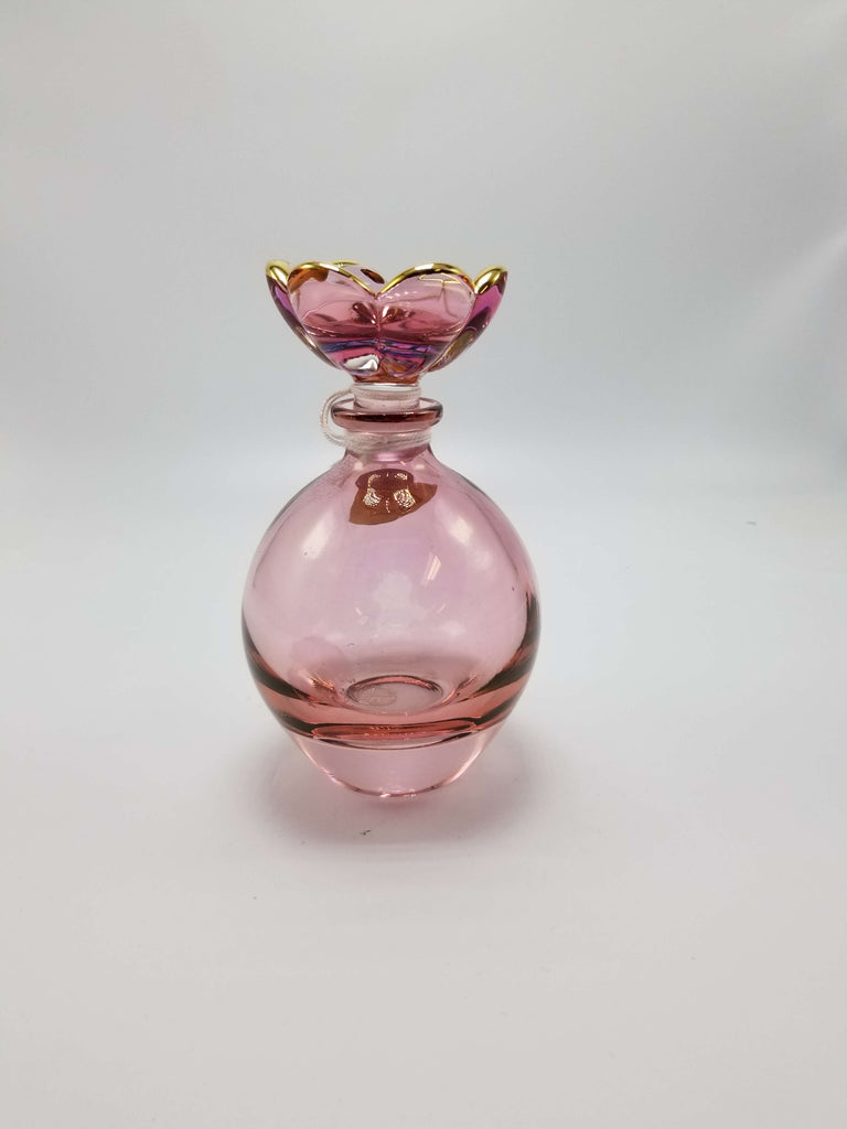 Pink crystal perfume bottle with flower stopper
