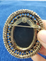 Black resin brooch