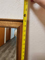 Vintage classic rectangular mirror featuring a warm-toned wooden frame