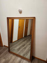 Vintage classic rectangular mirror featuring a warm-toned wooden frame
