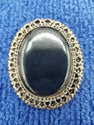 Black resin brooch